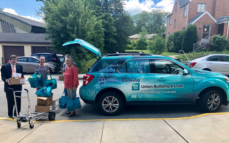 Brentwood Bank president Tom Bailey helping to unload donations at Women's Center of Beaver County.